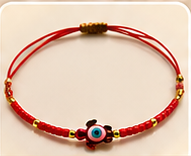 Bracelet cordon tortue œil turquoise porte-bonheur, couleur rouge
